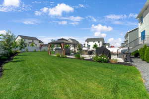 View of yard with a patio area, a gazebo,  a hot tub, and stairway