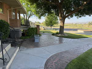 View of patio / terrace featuring central air condition unit and stairs