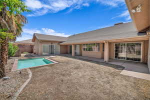 View of swimming pool featuring a patio and a fenced backyard