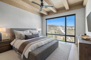 Bedroom featuring wood ceiling with exposed beams, light wood-style flooring, and ceiling fan