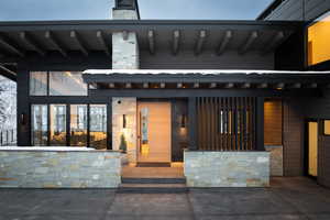 View of exterior entry with stone siding