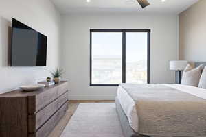 Bedroom featuring light wood-type flooring, recessed lighting, and baseboards