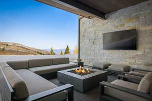 View of patio / terrace featuring an outdoor living space with a fire pit