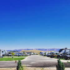 View of mountain backdrop featuring nearby suburban area
