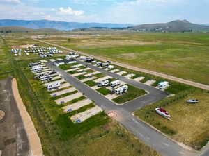 Aerial view of sparsely populated area with a mountain backdrop