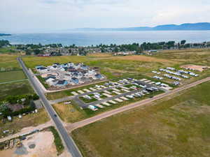 Aerial view of property's location featuring a water and mountain view