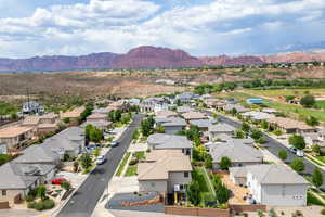Aerial view of residential area featuring a mountainous background