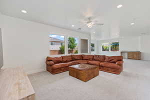 Living room featuring light colored carpet, healthy amount of natural light, recessed lighting, and ceiling fan