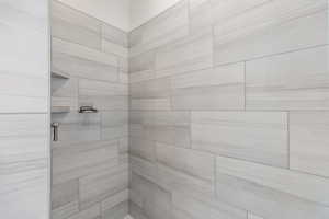 Full bathroom featuring a stall shower