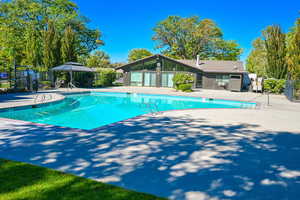 Community pool featuring a patio and a gazebo and clubhouse