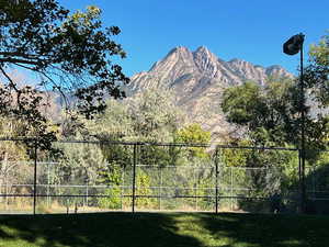 View of mountain backdrop near tennis court area