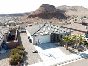 Aerial perspective of suburban area with a mountain backdrop