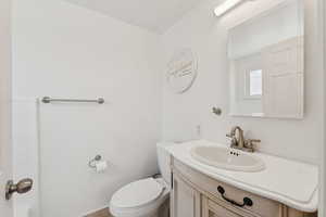 Bathroom with vanity and toilet
