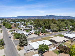 Aerial perspective of suburban area with a mountainous background
