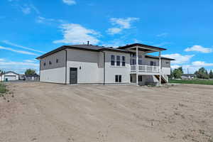 Back of house with stucco siding
