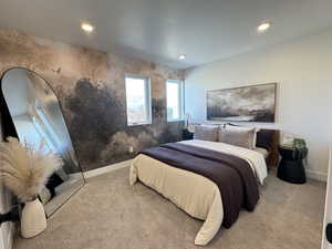Carpeted bedroom with baseboards and recessed lighting
