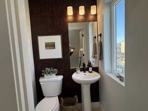 Half bath featuring toilet