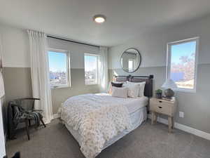 Carpeted bedroom featuring baseboards