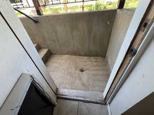 Rear entry with drain in case it rans or snows.
