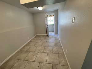 L-shaped family room offers room for hobby or exercise equipment and opens to the back yard.