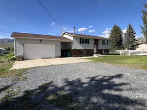 Oversize garage offers plenty of work and storage space.  Parking in front or to the side.