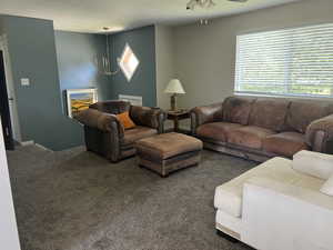 Comfortable living room opens into dining and kitchen. Furnishings are available.