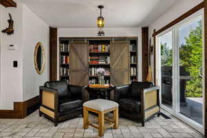 Sitting room featuring a barn door
