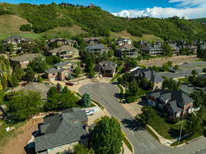 Aerial view of property's location featuring nearby suburban area