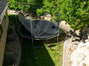 View of yard with a trampoline