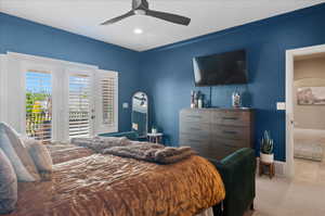 Bedroom featuring access to outside, carpet flooring, a ceiling fan, baseboards, and recessed lighting