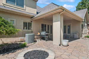 View of patio / terrace featuring central AC and grilling area