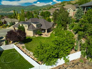 Aerial perspective of suburban area with a mountainous background