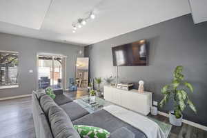 Living room featuring wood finished floors and baseboards