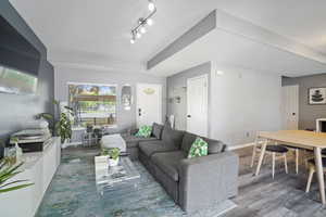 Living room with wood finished floors and baseboards