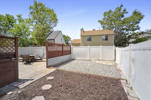 Fenced backyard featuring a patio area