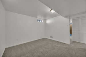 Basement with carpet and baseboards