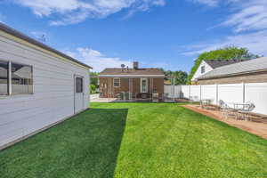 View of yard with a patio
