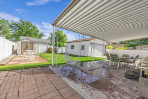 View of patio / terrace featuring an outbuilding and outdoor dining space