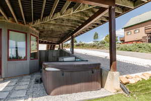 View of patio / terrace featuring a hot tub