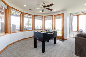 Game room with baseboards, light colored carpet, recessed lighting, and a ceiling fan