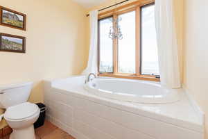 Bathroom with a bath and toilet