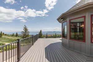 Wooden deck featuring a water view