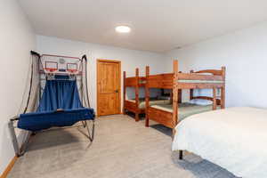 Bedroom with carpet and baseboards