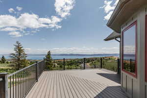 Wooden terrace featuring a water view