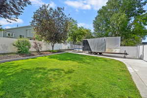 View of yard featuring concrete pad