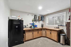Basement bedroom featuring non-fixed cabinets and bar