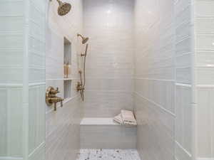 Bathroom featuring tiled shower