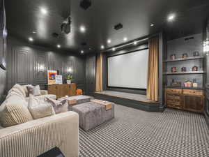 Carpeted home theater featuring recessed lighting