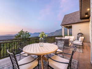 View of patio / terrace featuring a mountain view and outdoor dining area