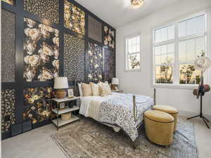 Carpeted bedroom with baseboards